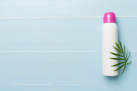 Natural deodorant on wooden background, top view
