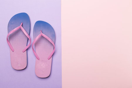 Bright flip flops on color background, top viewの写真素材