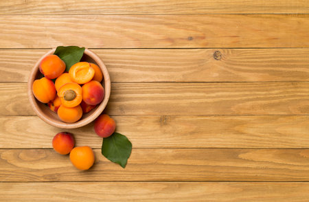 Composition with ripe apricots on wooden background, top view.の写真素材