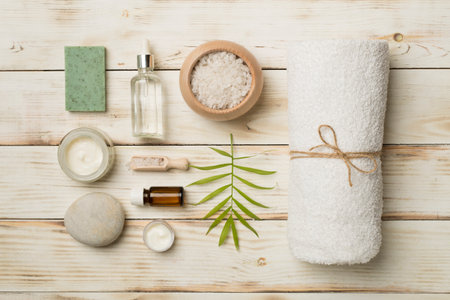 Composition with spa products on wooden background, top view.