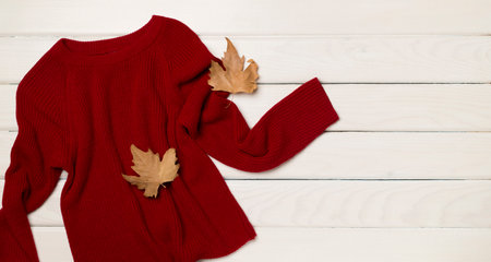 Flat lay of women's stylish autumn outfit on wooden background, top view.の写真素材