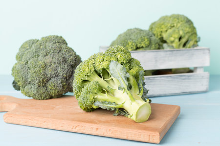 Fresh tasty broccoli on wooden tableの写真素材