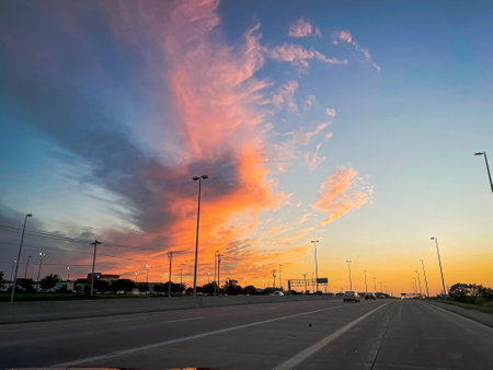 Sunset on the road in the evening. Beautiful sky background.の写真素材