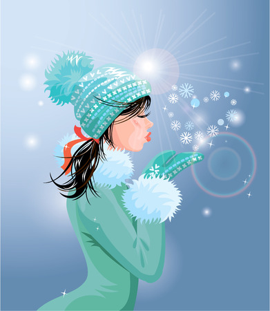 Beautiful brunette girl with warm blue winter hat is blowing snow from her hands (snowflakes in heart shape)のイラスト素材