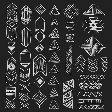 Hand drawn doodle vector tribal elements set (vol. 8 of 9). Decorative native american aztec symbols and geometric signs - triangle, arrows. White silhouettes isolated on black.のイラスト素材