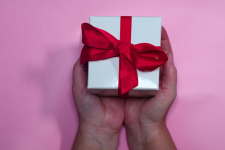RED PAPER HEARTS ON PINK BACKGROUND