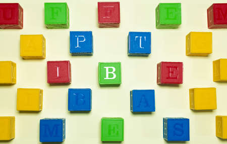 COLORFUL CUBE TOYS IN A YELLOW BACKGROUND