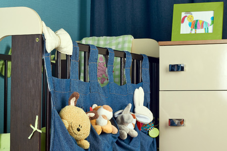 Beautiful interior of child bedroom  with bed and chest of drawersの写真素材