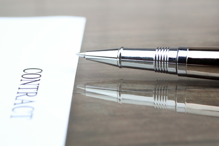 Close-up  silver pen on contract on the desk in the officeの写真素材