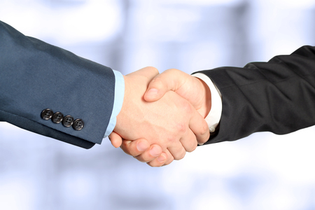 Close-up image of a firm handshake  between two colleaguesの写真素材