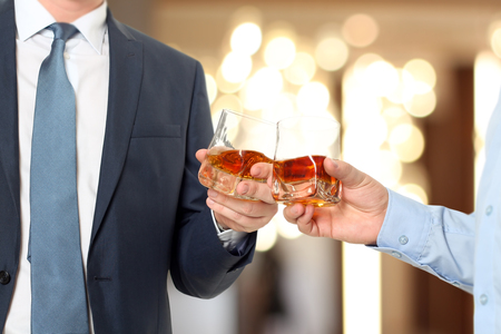 Holiday Event  business people cheering each other with Whiskyの写真素材