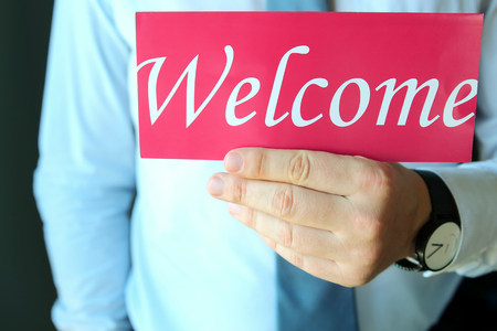 WÑ are hiring!   Labour wanted. Man inviting with word welcomeの写真素材