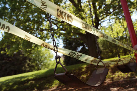 empty children playground swing during the coronavirus quarantine