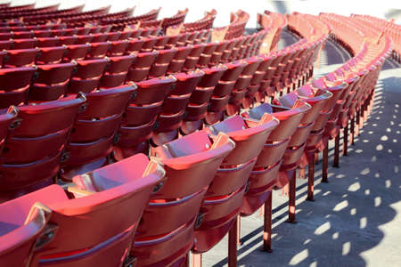 Empty raws of red chairs outside. Covid-19 quarantineの写真素材