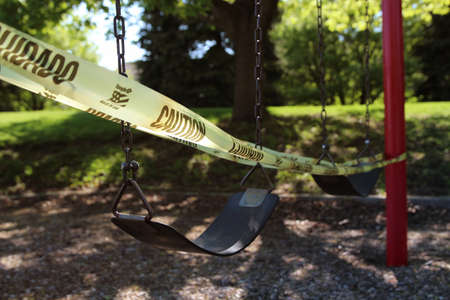 empty children playground swing during the coronavirus quarantine