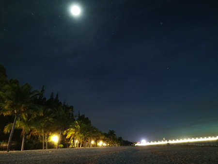 Haihua Island, beach, sunset, sunset, sea breeze, coconuts, coconut trees, waves, sea water, Hainan, shelter from the coldの写真素材