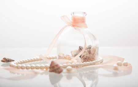 Pearl necklace and seashellsの写真素材