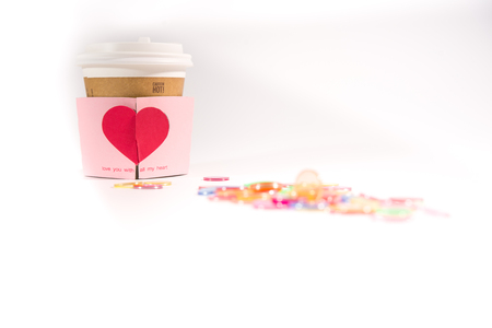 background of a cup sleeve with a heart-shape cardの写真素材