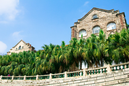 Buildings and trees under blue skyのeditorial素材