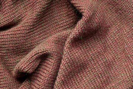 Pleats on fabric, knitted material of brown color, folds.の写真素材