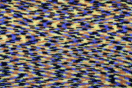 yellow blue back brown knitted knitting pattern.の写真素材