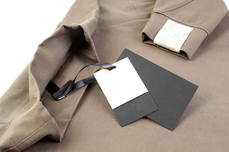 macro mock up empty black and white paper tag attached to the collar with a black satin ribbon and a...
