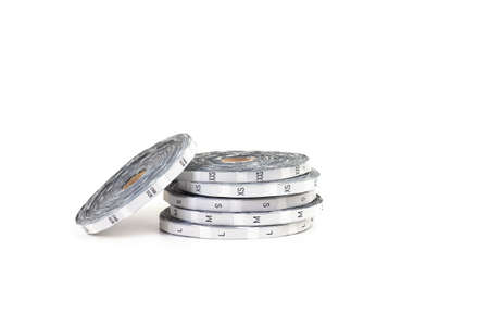Professional tailoring equipment in form of silver coils with size tags and inscription of sizes...