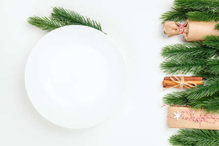 top view close-up on white empty plate with copy space on white isolated background with frame of...