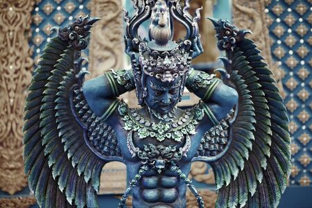 Statue of angel near Blue Temple in Chiang Rai, Thailandの写真素材