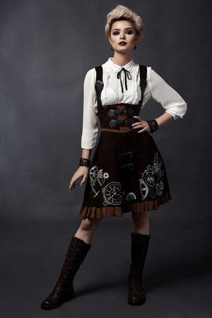 Beautiful blonde girl in steampunk style costumeの写真素材