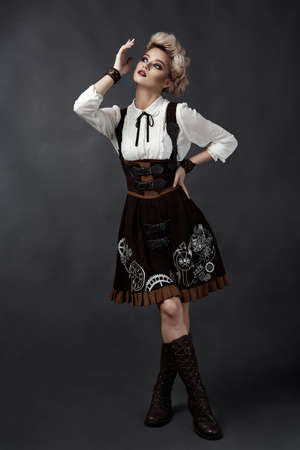 Beautiful blonde girl in steampunk style costume.の写真素材