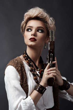 Beautiful blonde girl in steampunk style costumeの写真素材