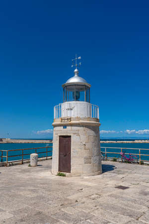 Lighthouse at the entrance to the port of Rethymno, Crete, Greeceの写真素材