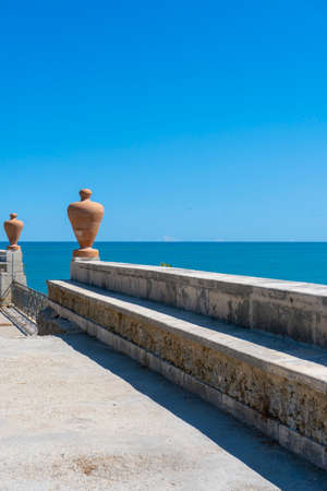 View of the sea from the terrace of an old house on a background of blue skyの写真素材