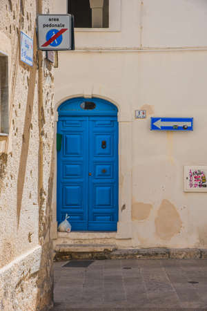 Greece, Crete, old blue door and white wallの写真素材