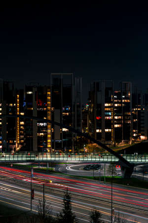 Cityscape of the city at night. Light trails on the street.