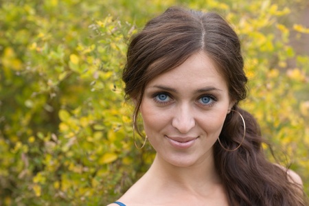 Beautiful smiling girl in a park.の写真素材