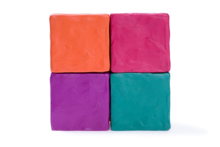 Four cubes of colored plasticine.の写真素材