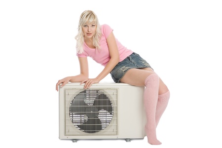 Beautiful girl with a new model for the air conditioner.の写真素材