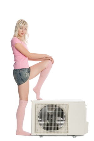 Beautiful girl with a new model for the air conditioner.の写真素材