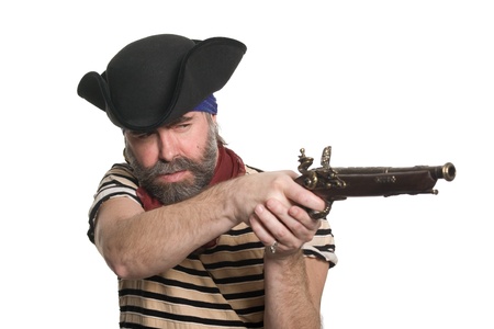 Bearded pirate in tricorn hat with a musket.の写真素材