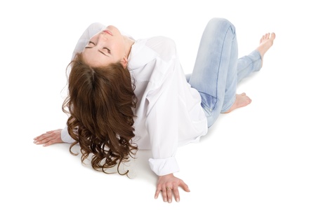 Reclining brunette girl with long hair. の写真素材