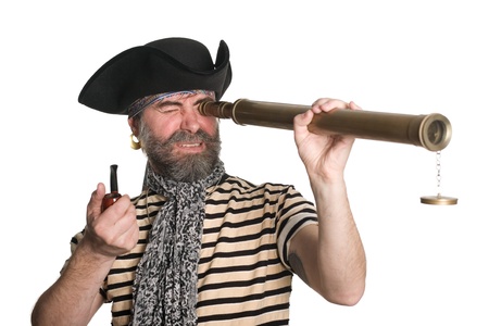 Pirate looks through a telescope and smokes a pipe.の写真素材