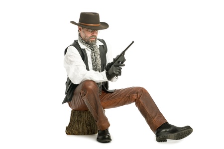 Man dressed as a retro style with a Mauser sitting on the log.