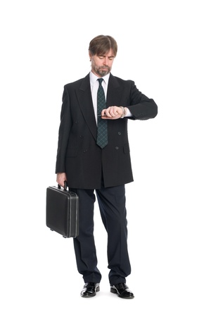Businessman with suitcase looking at your watch.の写真素材