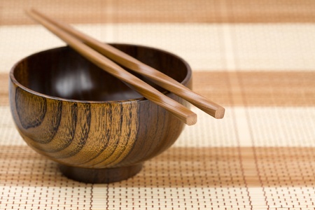 Dish(platter) and chopsticks on a bamboo mat.の写真素材