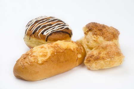 Cake from the layred paste, donut(doughnut) and  roll with cheese.