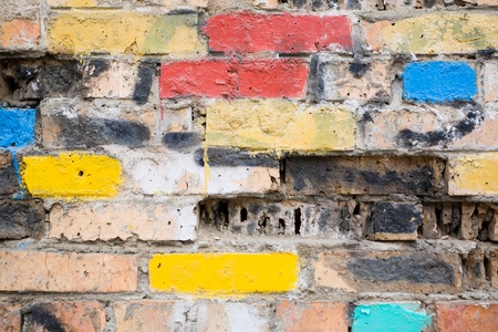 Old brick wall under influence of erosionの写真素材