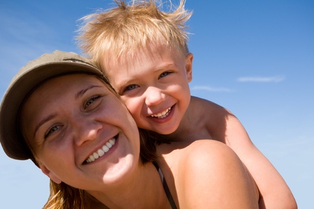 Mother and child on a beach in summer day.の写真素材