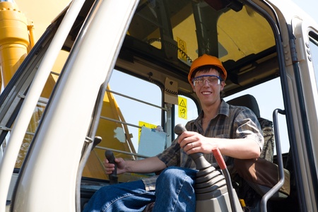 Operator of a excavator(dredge) on a working site.の写真素材